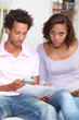 Couple calculating their budget