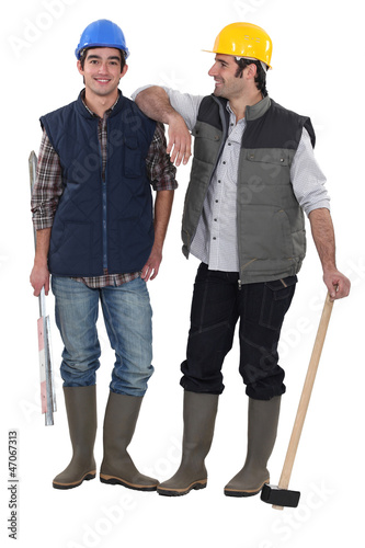 Photo: Two manual workers stood together Two manual workers stood together