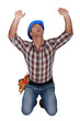 Builder holding up invisible object