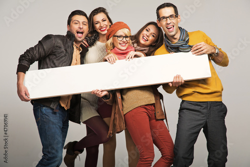 Photo: Smiling people with empty board Smiling people with empty board