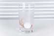 Dental prothesis in a water glass with cleaning tabs