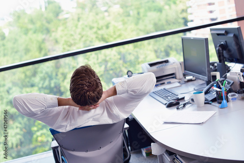 Photo: happy young business man at office happy young business man at office