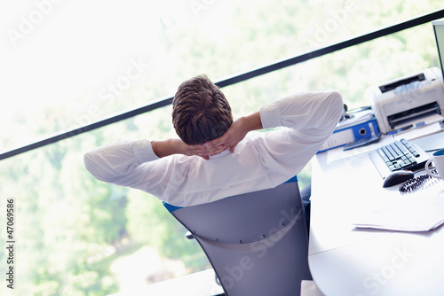 Photo: happy young business man at office happy young business man at office