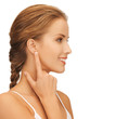 woman pointing to ear