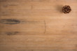 A Single Pine Cone on Butcher Block
