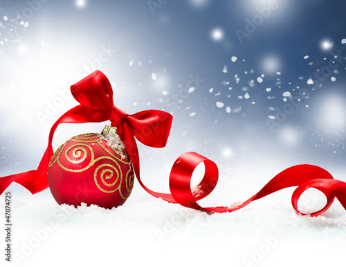 Photo: Christmas Holiday Background with Red Bauble and Snow Christmas Holiday Background with Red Bauble and Snow