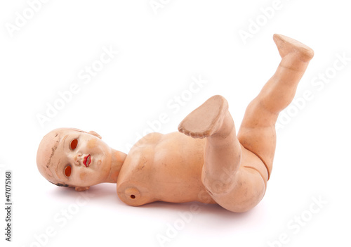 Photo: Abandoned child's baby doll with clipping path Abandoned child's baby doll with clipping path