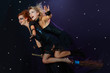 two witches flying on broom