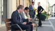 Successful business people with laptop in the city