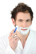 Man shaving his beard