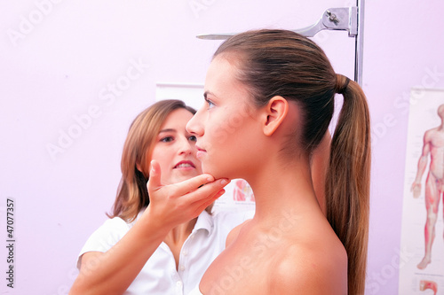 Photo: doctor measuring patients height doctor measuring patients height
