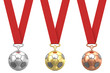 Gold, silver and bronze soccer ball with red ribbons