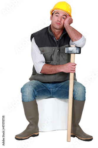 Photo: Bored construction worker Bored construction worker