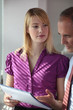 Colleagues explaining her work to boss