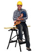 Tradesman holding a jigsaw