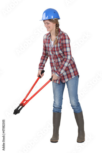 Photo: Woman holding bolt cutters Woman holding bolt cutters