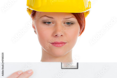 Photo: handwerkerin mit wasserwage handwerkerin mit wasserwage