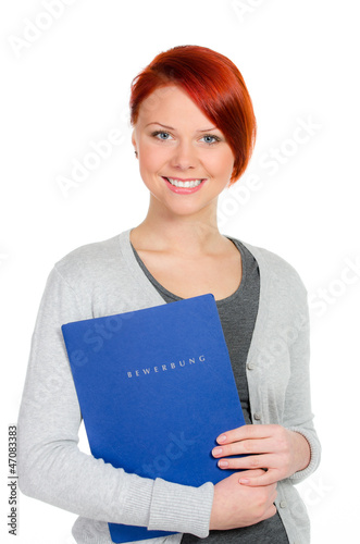 Photo: rothaarige schülerin mit bewerbungsmappe rothaarige schülerin mit bewerbungsmappe