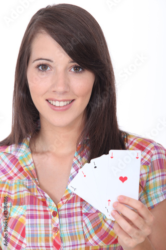 Photo: Girl showing playing cards Girl showing playing cards
