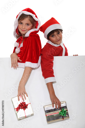 Photo: Children dressed as Santa Claus Children dressed as Santa Claus