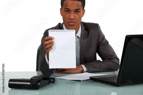 Photo: Businessman with a blank notebook Businessman with a blank notebook
