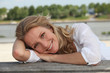 Woman laying on jetty
