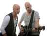guitarist and singer performing (white background)