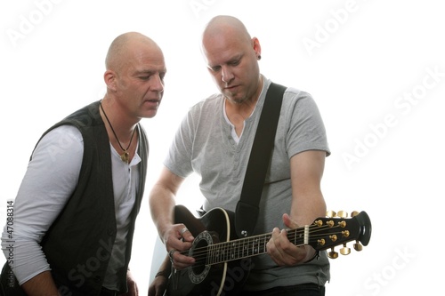 Photo: guitarist and singer performing (white background) guitarist and singer performing (white background)