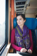 Photo: Portrait of a young woman traveling by train Portrait of a young woman traveling by train