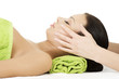 Beautiful relaxed woman enjoy receiving face massage