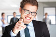 Businessman pointing his finger at you