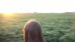 Girl Walking Dog at Sunset