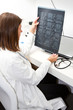 Photo: doctor looking at x-ray doctor looking at x-ray