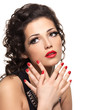 Beautiful fashion woman with red manicure and lips
