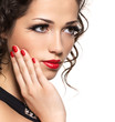 Beautiful fashion woman with red manicure and lips