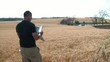 Man Reading Newspaper in Wheat Field