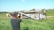 Man Taking Pictures on Farm