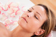 Woman undergoing acupuncture treatment