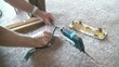 Carpet Layer Gluing Seams Together with Hot Iron