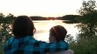 Kids Watching Beautiful Sunset at Lake