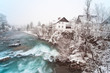 Rapid rocky river in winter. Skofja Loka, Sora river, Slovenia