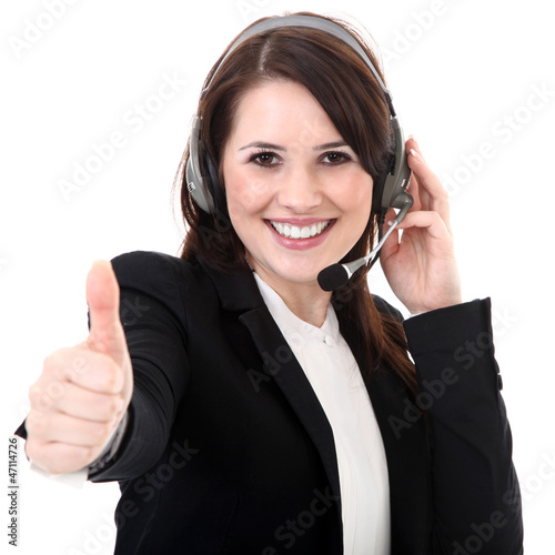 Photo: Junge Büro Frau mit Headset freundlich Daumen hoch Junge Büro Frau mit Headset freundlich Daumen hoch