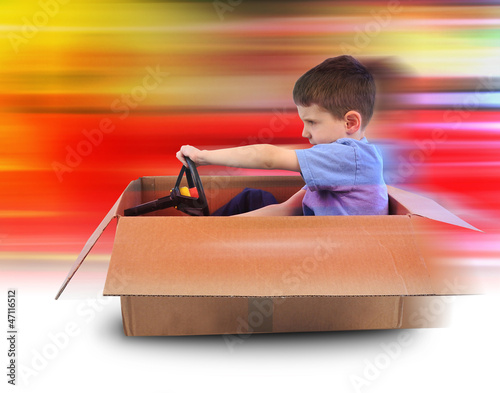 Photo: Boy Speed Driving in Box Car Boy Speed Driving in Box Car