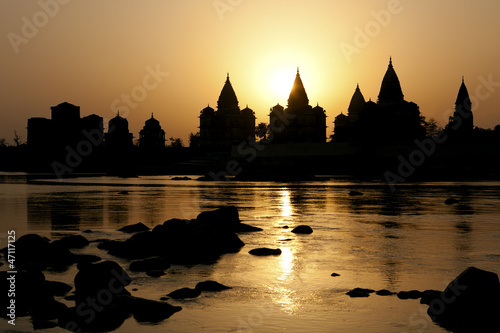 Photo: Sunset silhouette of Chhatris by the river in Orchha Sunset silhouette of Chhatris by the river in Orchha
