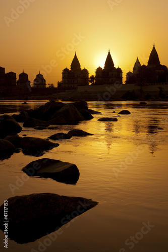 Photo: Sunset silhouette of Chhatris by the river in Orchha Sunset silhouette of Chhatris by the river in Orchha