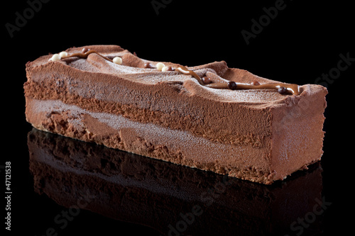 Photo: Chocolate cake on black background Chocolate cake on black background