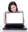 Smiling woman with blank laptop screen
