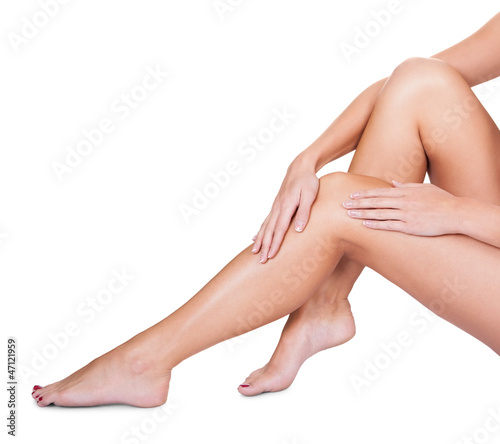 Photo: Woman caressing her silky smooth legs Woman caressing her silky smooth legs