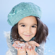 Winter girl Blowing Snow