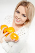 beautiful young and healthy women with yellow tangerines